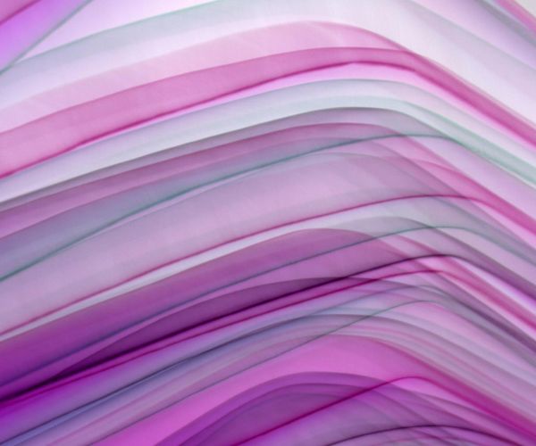 Abstract image representing airflow and breathing with soft pink waves.